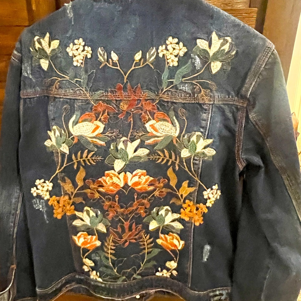 Distressed hand sewn embroidered denim jacket.